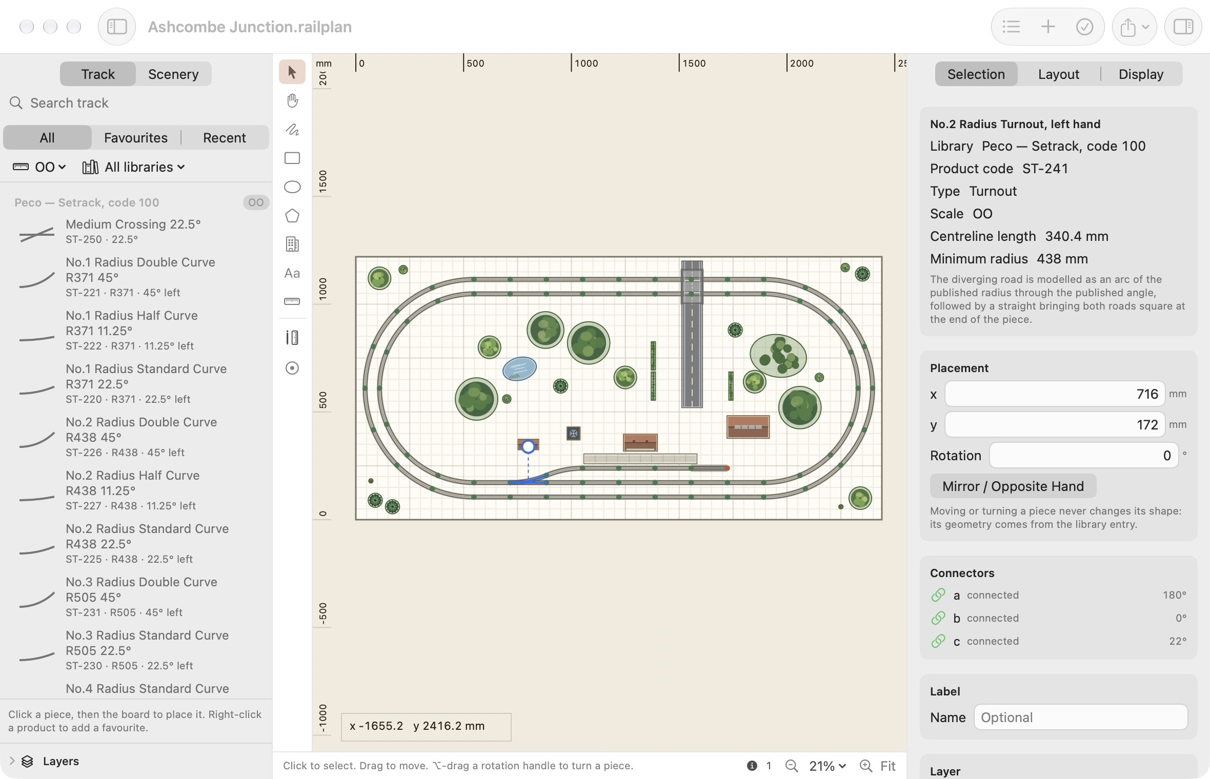 The Gauge Buddy window showing a double-track layout with a station, trees and a road